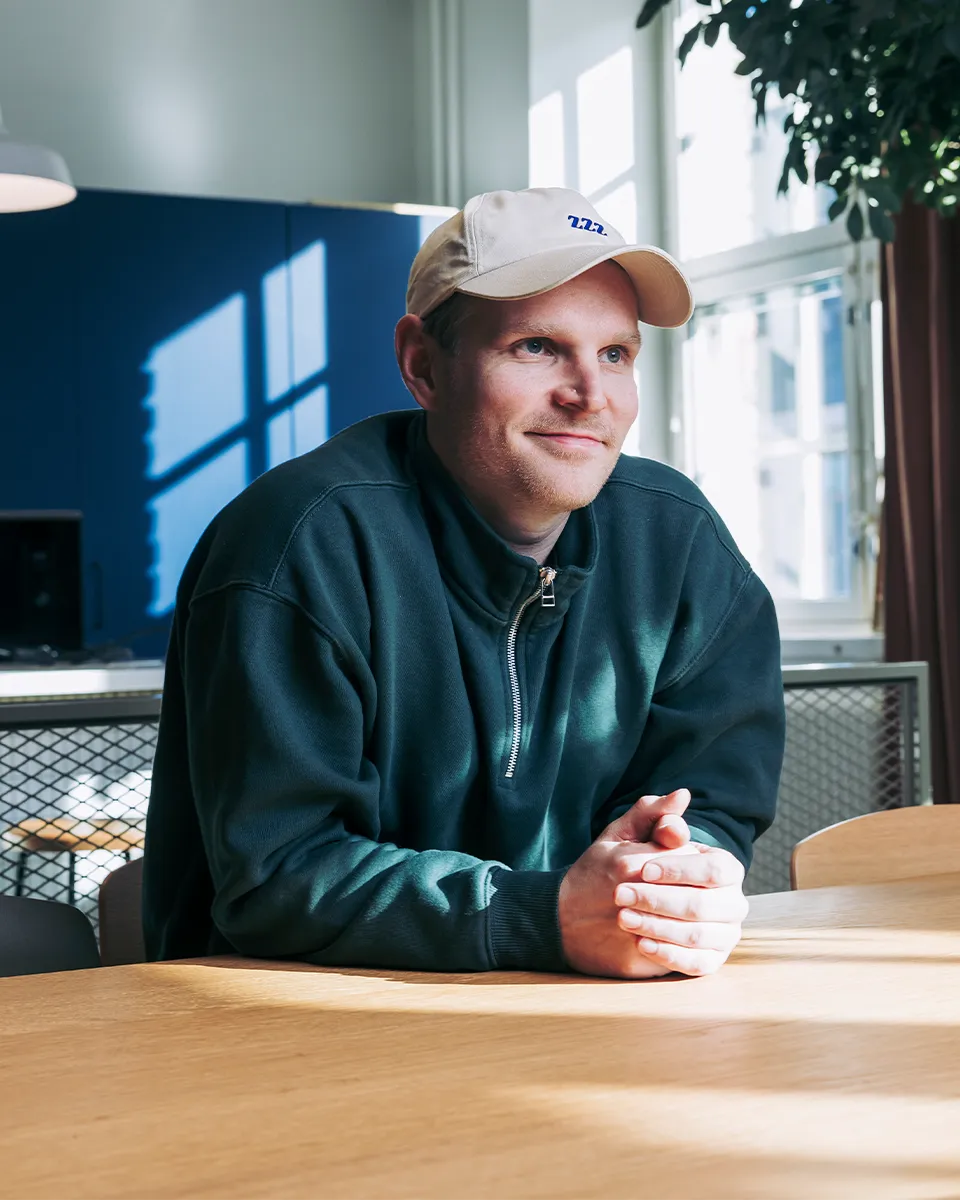 Small business owner relaxed at a table, confident his receipt records are tax-compliant