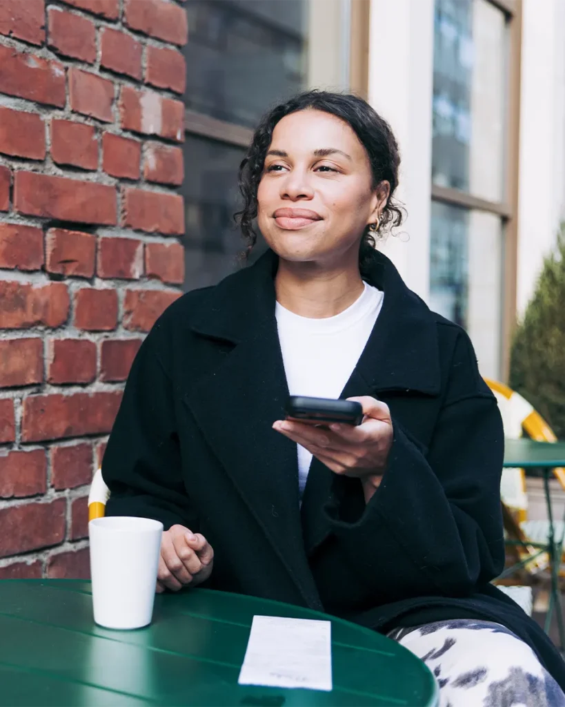 Woman taking a picture of a receipt