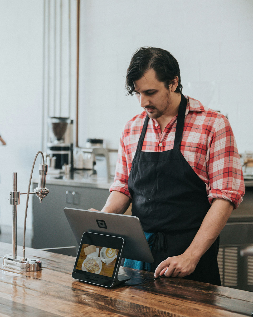 Man working behind the counter at a café
